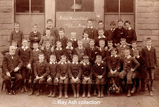 W.N. Statham's photograph of the Ist Class Boys at Matlock Board School. Mr. Edwin Davis, the Headmaster, is seated front left. Thomas Ash is easily identified because another boy has his hands on Thomas's shoulders. © Ray Ash